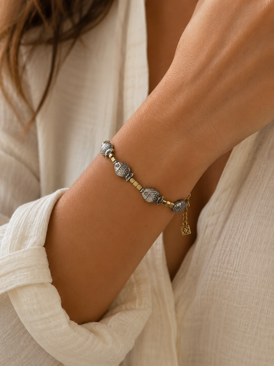 Gold Bracelet with Silver Fish