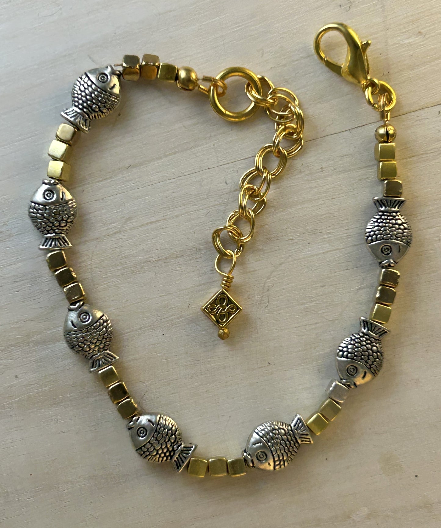 Gold Bracelet with Silver Fish